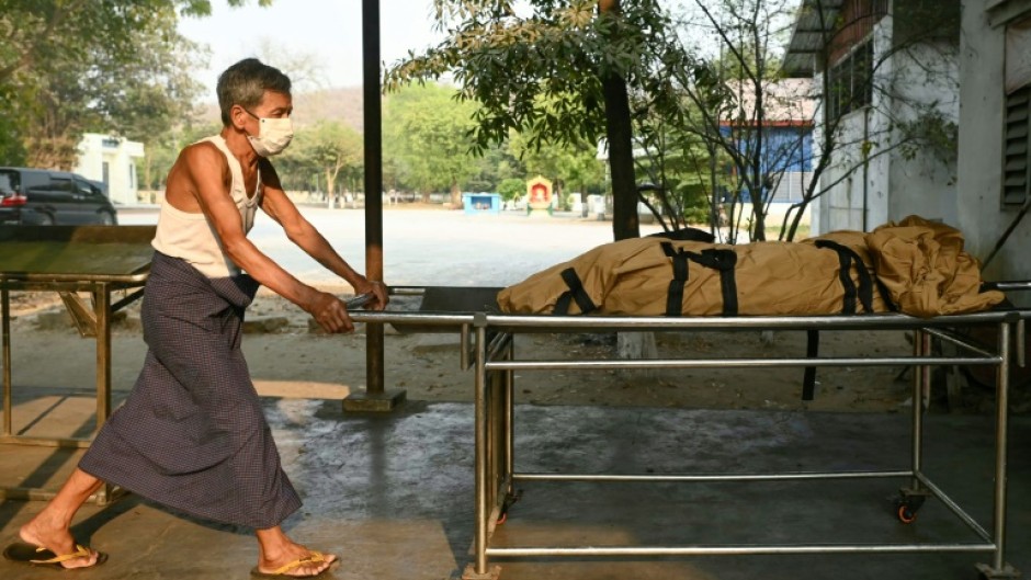 A worker transports the body of an earthquake victim for cremation at a facility on the outskirts of Mandalay, Myanmar on March 31, 2025