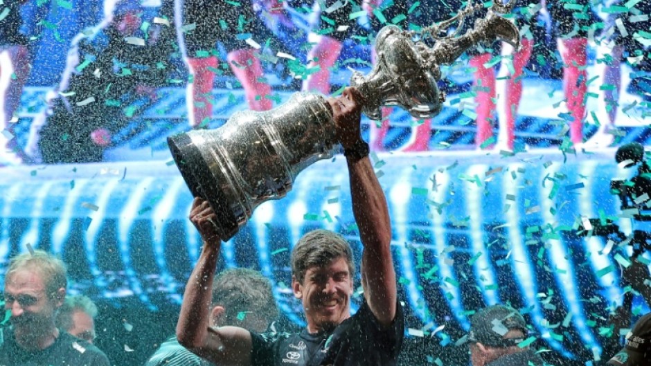 Team New Zealand's co-skipper and helmsman Peter Burling raises the America's Cup in Barcelona last year
