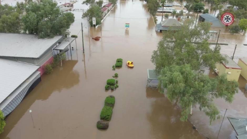 Emergency crews work in flood waters as outback Australia drenched