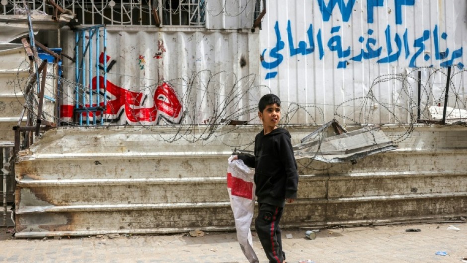 A Palestinian boy leaves empty-handed after finding this Gaza City bakery closed for want of flour after stocks ran out in the face of a month-old Israeli aid blockade.