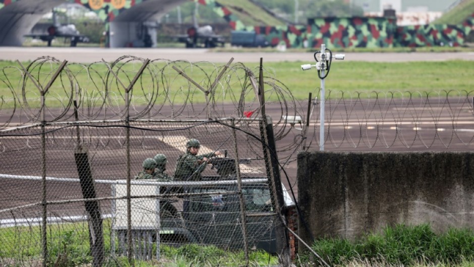 Taiwanese forces at Hsinchu air force base, as China holds military drills aimed at the self-ruled island