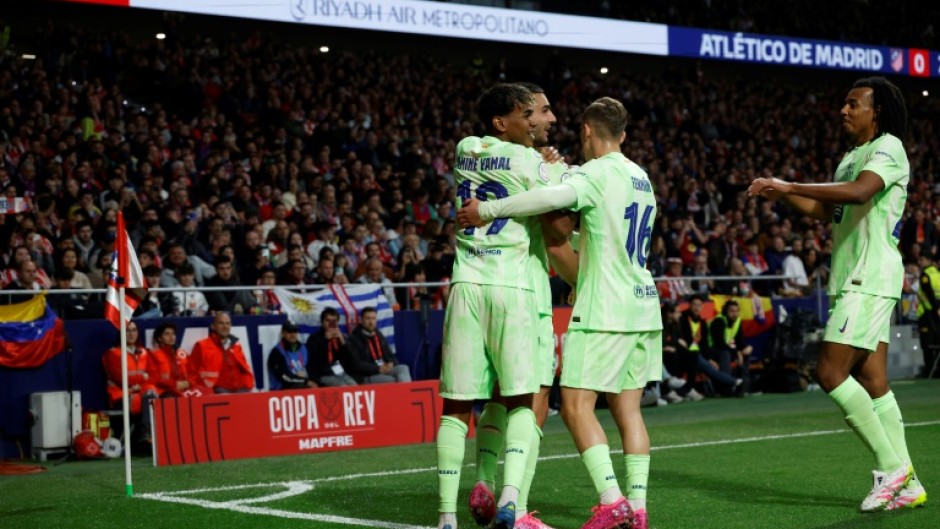 Barcelona's Spanish forward Ferran Torres (2L) celebrates scoring against Atletico Madrid in the Copa del Rey semi