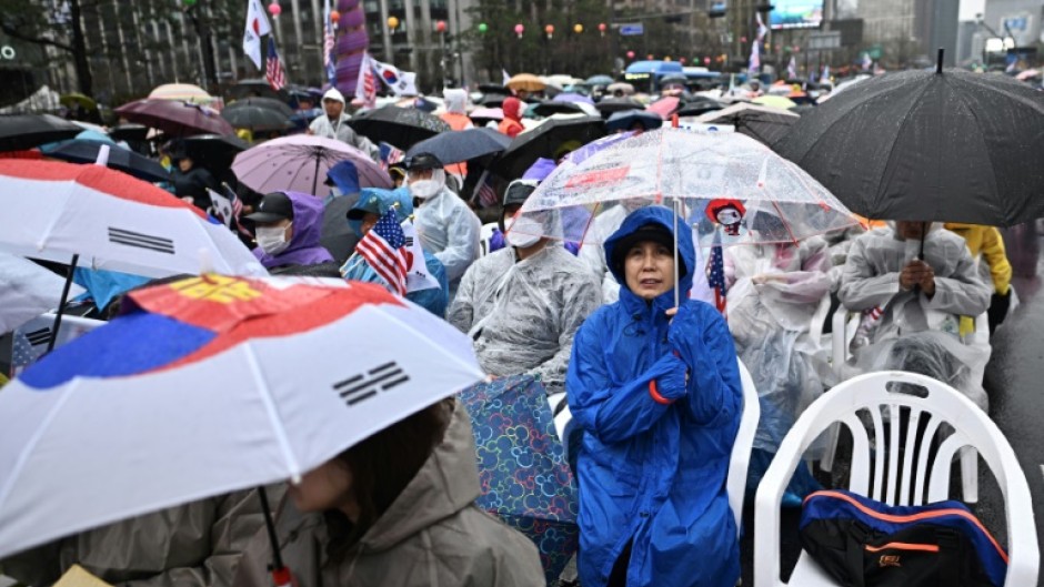 Yoon's supporters took to the streets in capital Seoul and braved the rain, chanting slogans against his removal from office