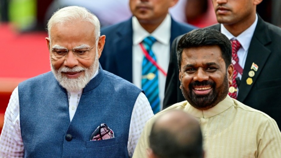 Sri Lankan President Anura Kumara Dissanayake (R) rolled out the red carpet for Indian leader Narendra Modi (L) and conferred on him the country's highest civilian honour