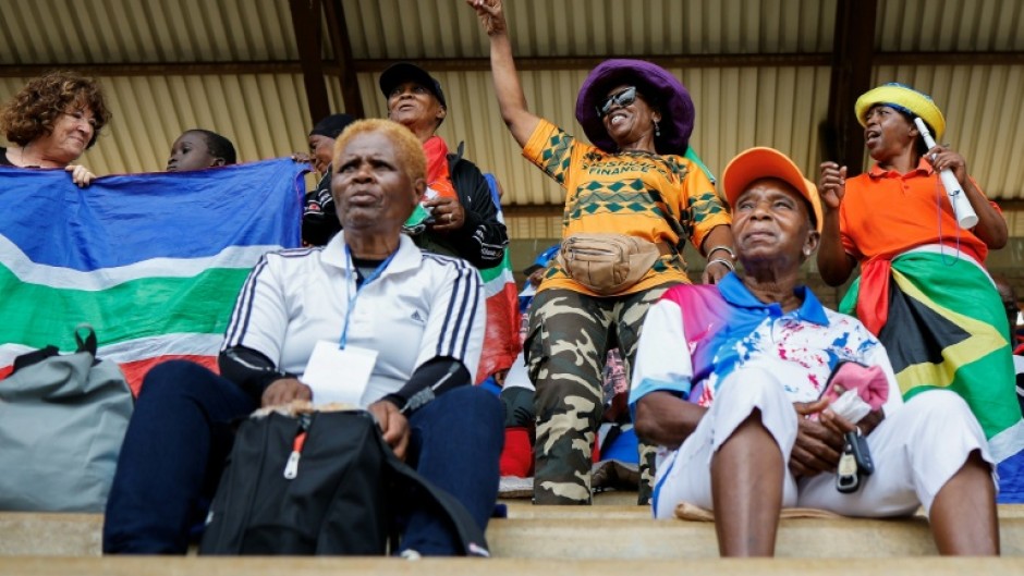 The crowd applauded as teams entered the stadium hand in hand with young mascots