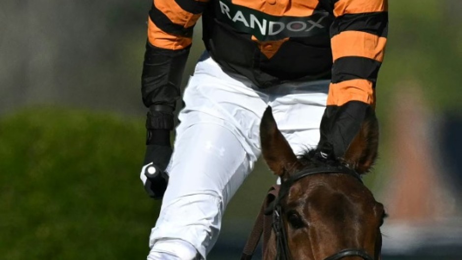 Patrick Mullins won the 2025 Grand National on board Nick Rockett, trained by his father Willie Mullins