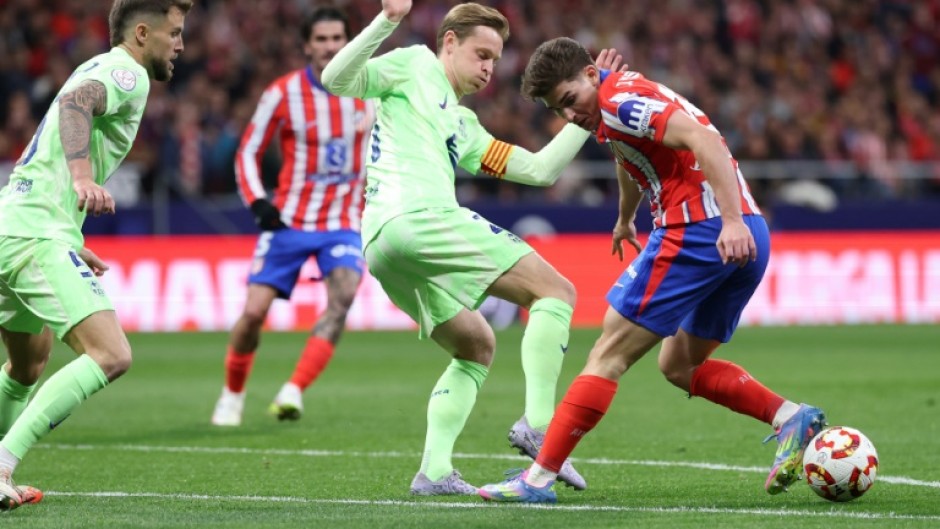 Barcelona's Dutch midfielder Frenkie De Jong (C) has found his footing after a few tricky years at the club