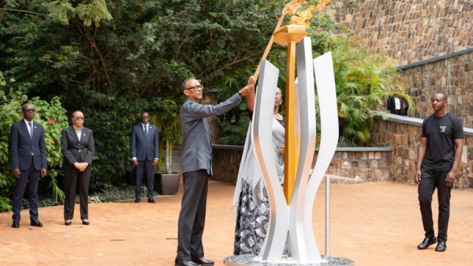 Rwandan President Paul Kagame (C) spoke about countries that have issued sanctions against it during an event to mark the start of commemorations for the 1994 genocide
