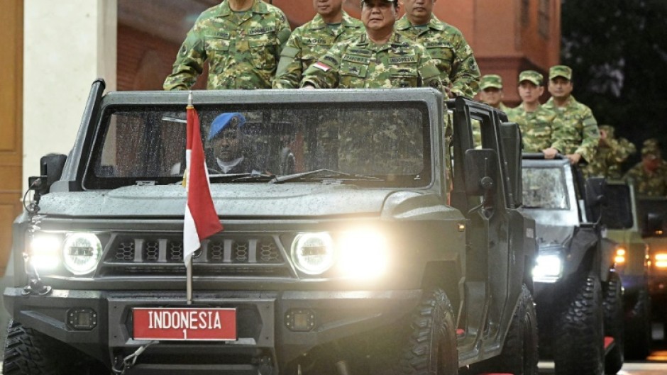 Indonesia's President Prabowo Subianto (3L) at the military academy during their cabinet retreat in Magelang, Central Java