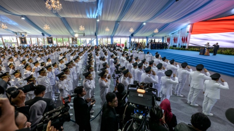 Regional heads taking their oath of office during their inauguration by Indonesian President Prabowo Subianto at the Presidential Palace in Jakarta