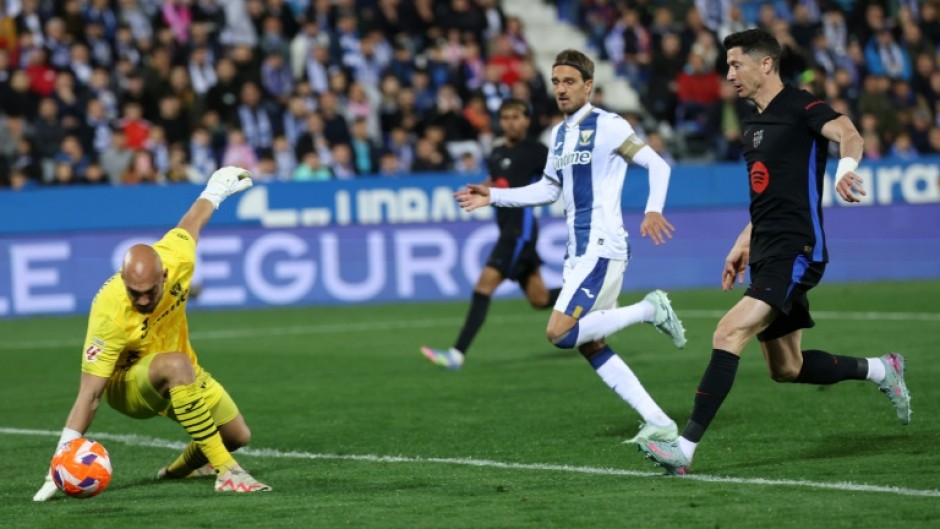 Leganes' Serbian goalkeeper Marko Dmitrovic (L) can't keep out Jorge Saenz's own goal