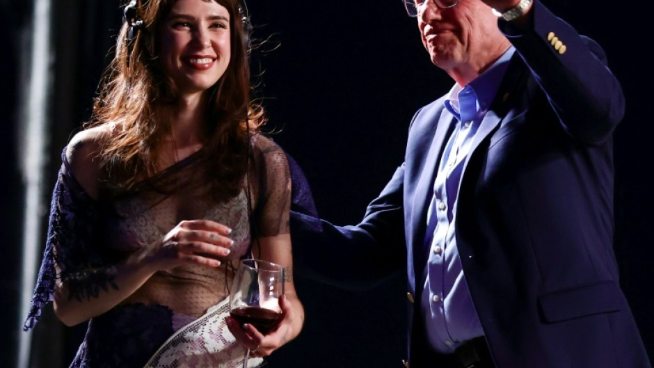Singer Clairo (L) and US Senator Bernie Sanders (R) onstage at the Coachella music festival