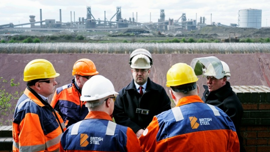 British Steel staff members gather at the plant as they take over its running from the Chinese owners Jingye