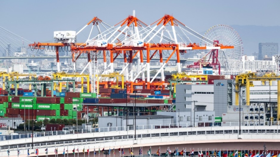 Containers being loaded in Japan are now part of a global tariff war launched by US President Donald Trump