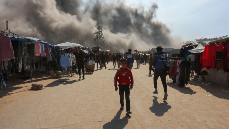 Smoke billows following an Israeli strike on a metalsmith workshop at the Zaytoun neighbourhood in Gaza City