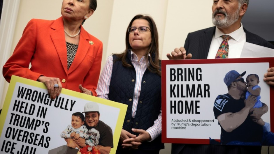 US lawmakers Nydia Velazquez (L) and Juan Vargas (R) hold signs with pictures of Kilmar Abrego Garcia, a migrant and US resident wrongly deported to El Salvador