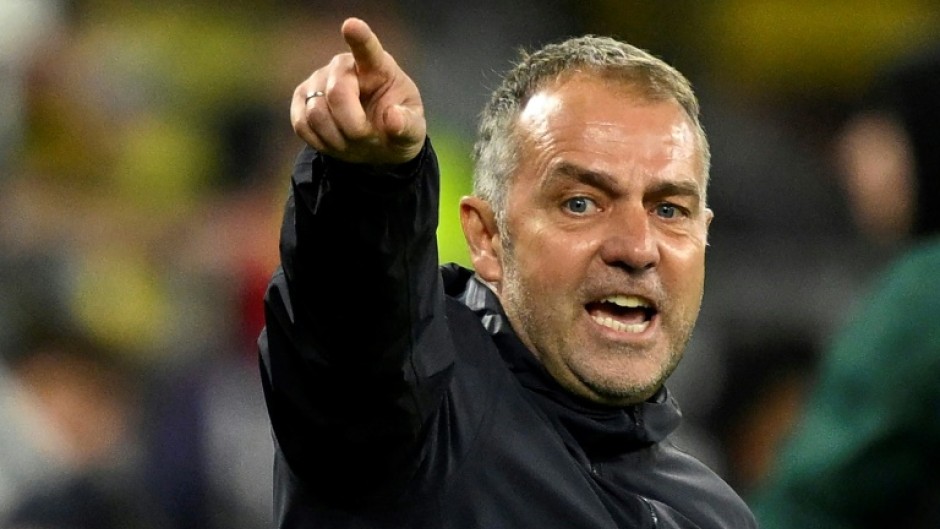 Barcelona coach Hansi Flick reacts during the Champions League quarter-final second leg against Borussia Dortmund on April 15, 2025