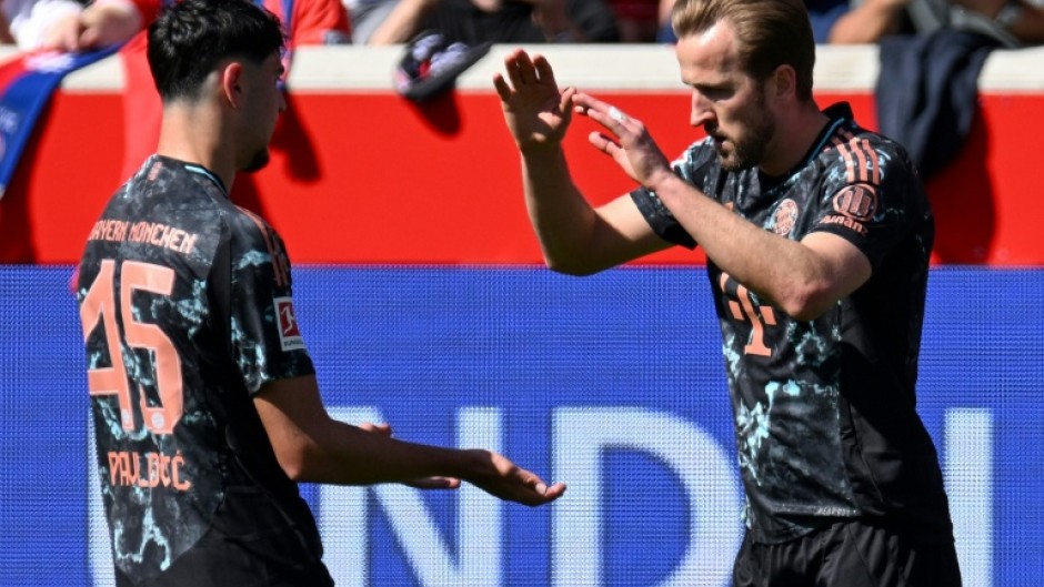 Bayern Munich forward Harry Kane (R) scored his 24th league goal of the season against Heidenheim
