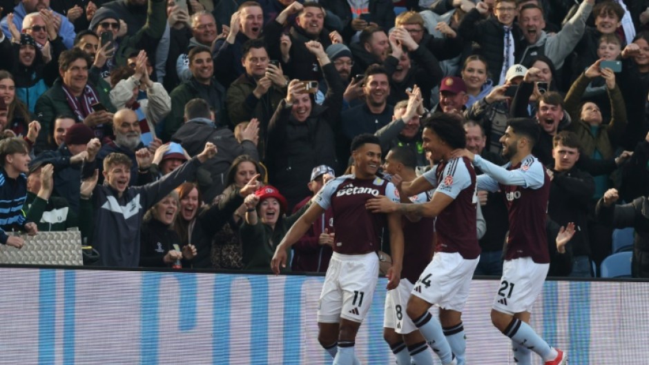 Aston Villa's Ollie Watkins (L) celebrates after scoring against Newcastle