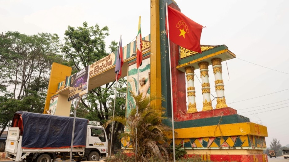 The flag of the Myanmar National Democratic Alliance Army (MNDAA) raised on a welcome arch in Lashio on April 9