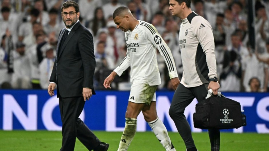 Kylian Mbappe hobbles of the pitch during REal Madrid's Champions League quarter final tie with Arsenal at the Santiago Bernabeu
