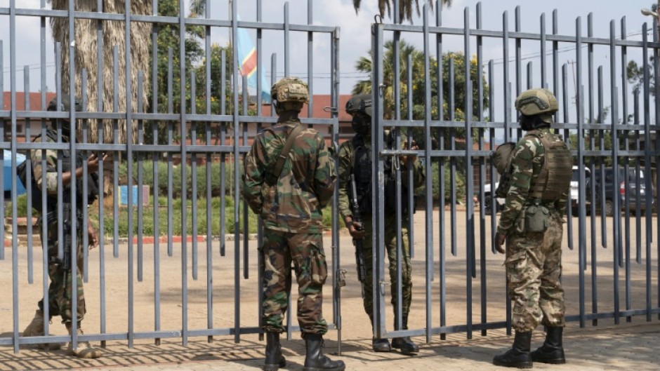 Members of the M23 movement stand at the gate of the local government offices in Bukavu in this March 2025 photo