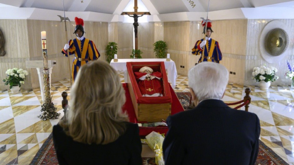 Italy's President Sergio Mattarella and his daughter Laura pay respects in front of the coffin of the late Pope Francis in the Chapel of Santa Marta in The Vatican