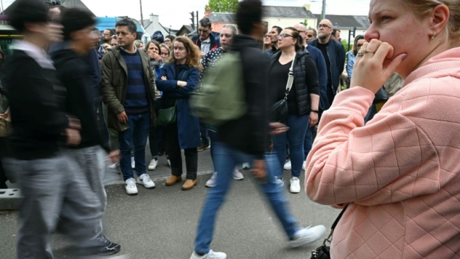 Concerned parents gathered outside of the Notre-Dame de Toutes-Aides secondary school after the attack