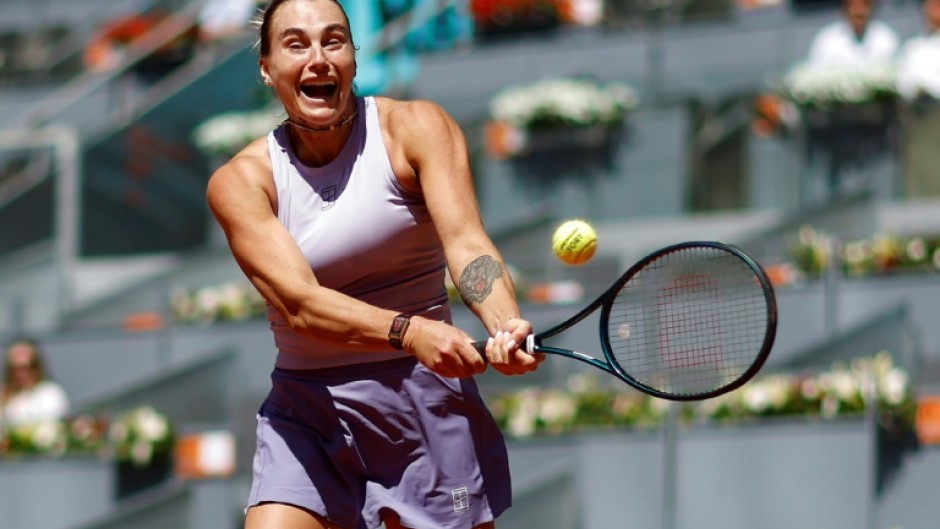 Belarus' Aryna Sabalenka returns a ball to Russia's Anna Blinkova