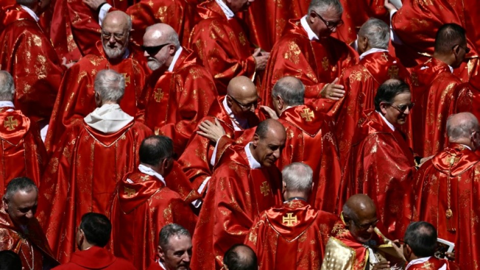 Cardinals embraced after Pope Francis's funeral ceremony in St Peter's Square at the Vatican