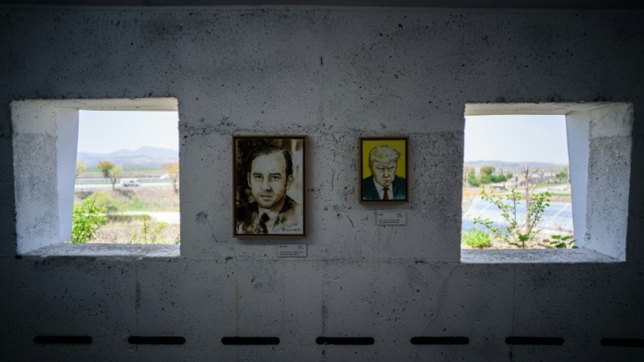 Hung between the bunker's narrow loopholes overlooking the North are cartoonist Kim Dae-nyeon's arwork