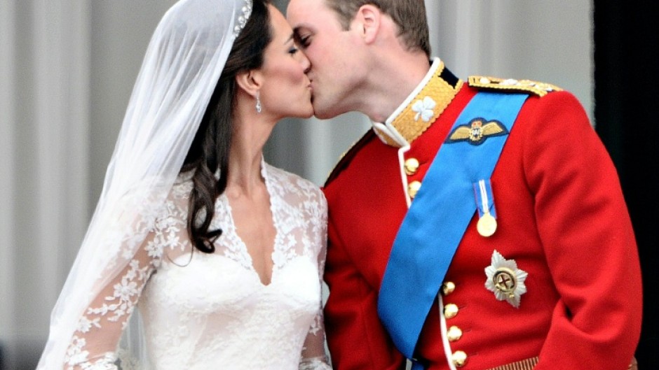 Prince William kisses his wife, Catherine, on the balcony of Buckingham Palace on their wedding day in 2011