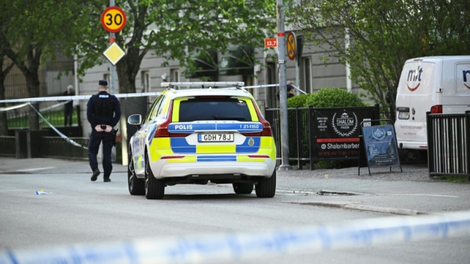 Police officers cordoned off the scene after the shooting in Uppsala