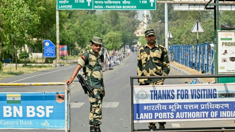 Indian Border Security Force personnel stand guard near the India-Pakistan Wagah border post