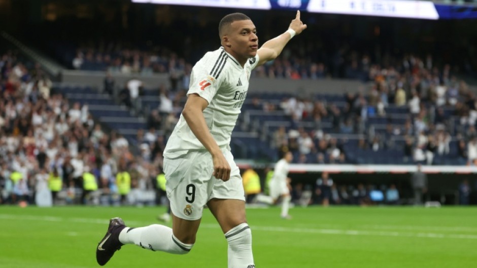 Real Madrid's French forward Kylian Mbappe celebrates after scoring his second against Celta Vigo