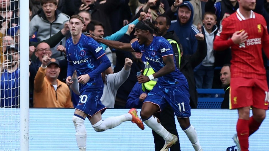 Chelsea's Cole Palmer (L) celebrates after scoring against Liverpool