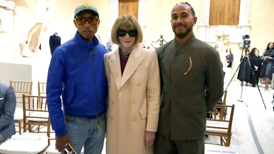 Pharrell Williams (L) and Lewis Hamilton (R), posing with Vogue editor Anna Wintour, are two of the co-chairs of the Met Gala