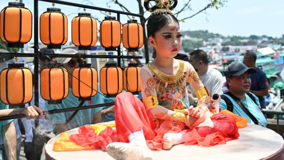 Tourists from Communist Party-ruled mainland China visited Hong Kong to experience traditional Chinese culture not often seen back home