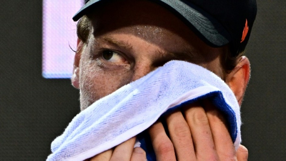 Jannik Sinner washes his face during an open training ahead of his return to action at the Rome Open