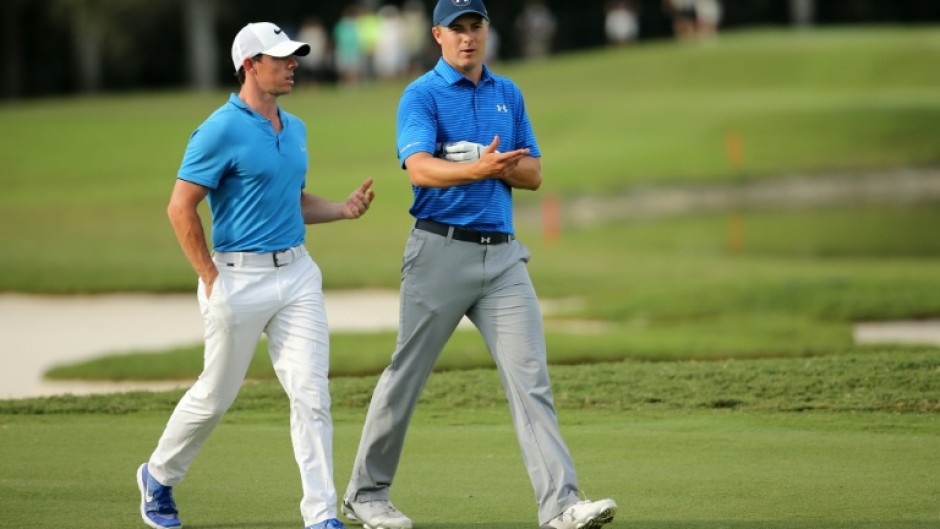 American Jordan Spieth, right, seeks a PGA Championship victory to complete a career Grand Slam and takes inspiration from Northern Ireland's Rory McIlroy, left, winning the Masters to complete his own career Slam