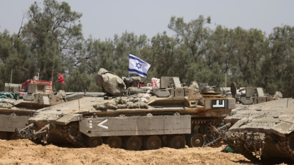 Israeli troops deploy at a position near the southern Israeli border with the Gaza Strip, on May 8, 2025