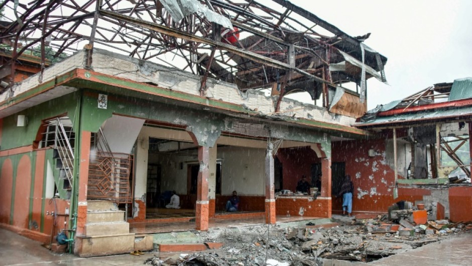 Worshippers held Friday prayers at a mosque in Pakistan-administered Kashmir that was damaged by Indian air strikes