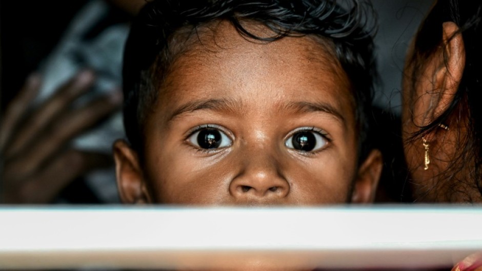 A boy looking out of the train