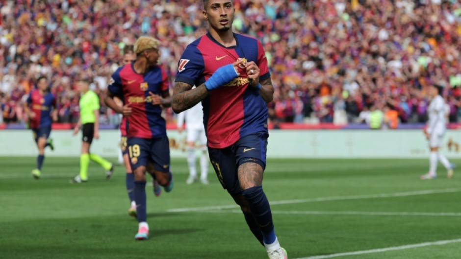 Barcelona's Brazilian forward Raphinha celebrates scoring their fourth goal against Real Madrid