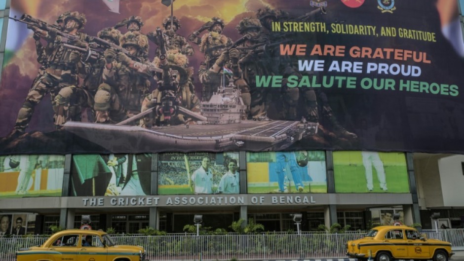 Taxis drive past a hoarding on the main gate of Eden Gardens in Calcutta acknowledging the efforts of the Indian armed forces during the recent India-Pakistan conflict