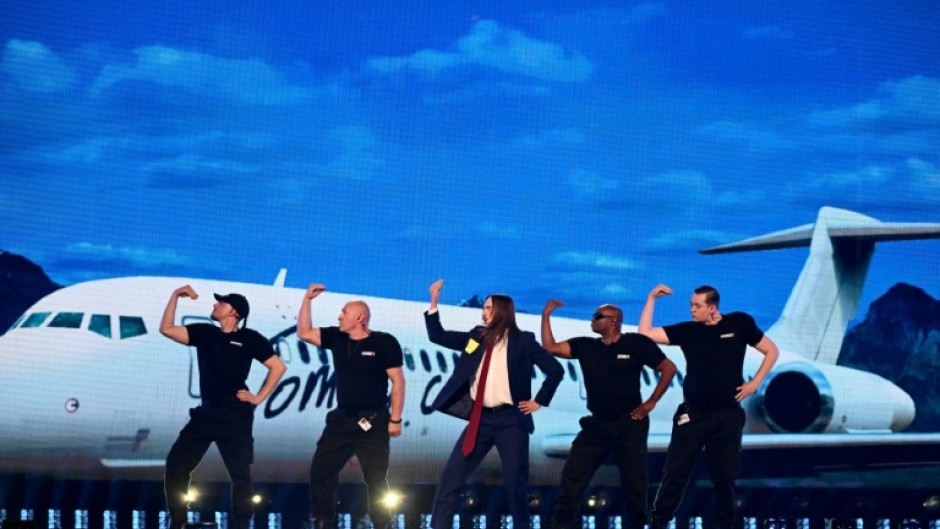 Estonian singer Tommy Cash (C) made it through to the Eurovision final with his song 'Espresso Macchiato'