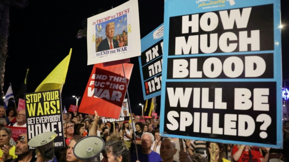 Supporters of the remaining Israeli hostages in Gaza demonstrate outside the US embassy branch in Tel Aviv to urge US intervention to secure their negotiated release.