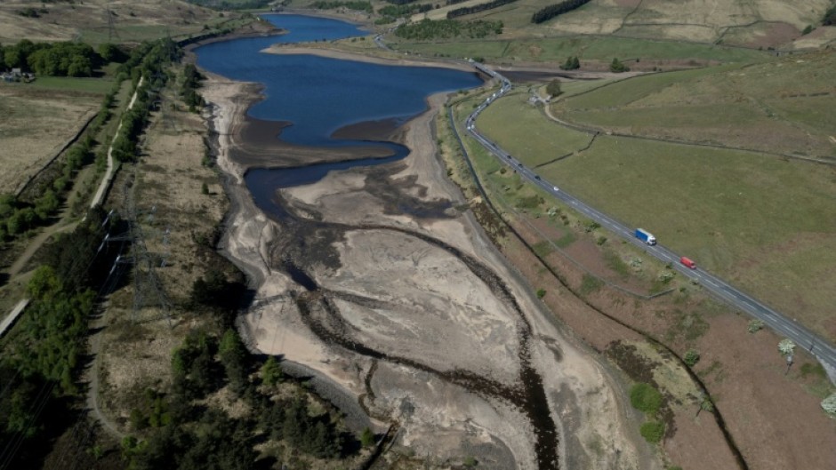 An aerial photo shows the bed of Woodhead Reservoir is partially revealed by falling water levels, near Glossop, northern England as the country experiences its driest start to spring in 69 years