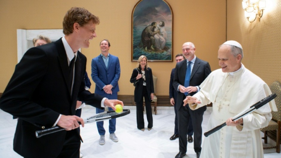 This photo taken and handout on May 14, 2025 by The Vatican Media shows Pope Leo XIV during a private audience with Italy's tennis player Jannik Sinner, in The Vatican.