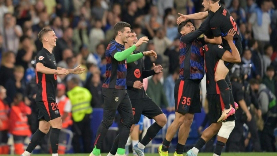 Barcelona players celebrate after winning the La Liga title for the 28th time